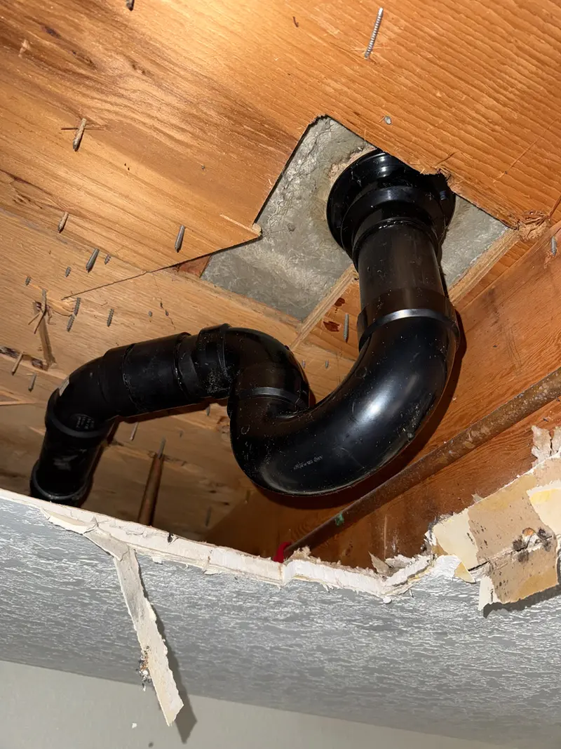 ABS drain & vent pipe repair through ceiling joists in Boring, Oregon, drain line repair by Bigfoot Plumbing licensed plumber
