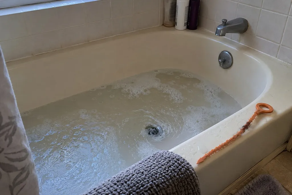 Slow-draining bathtub that still empties, a minor problem that can wait for a regular Troutdale appointment