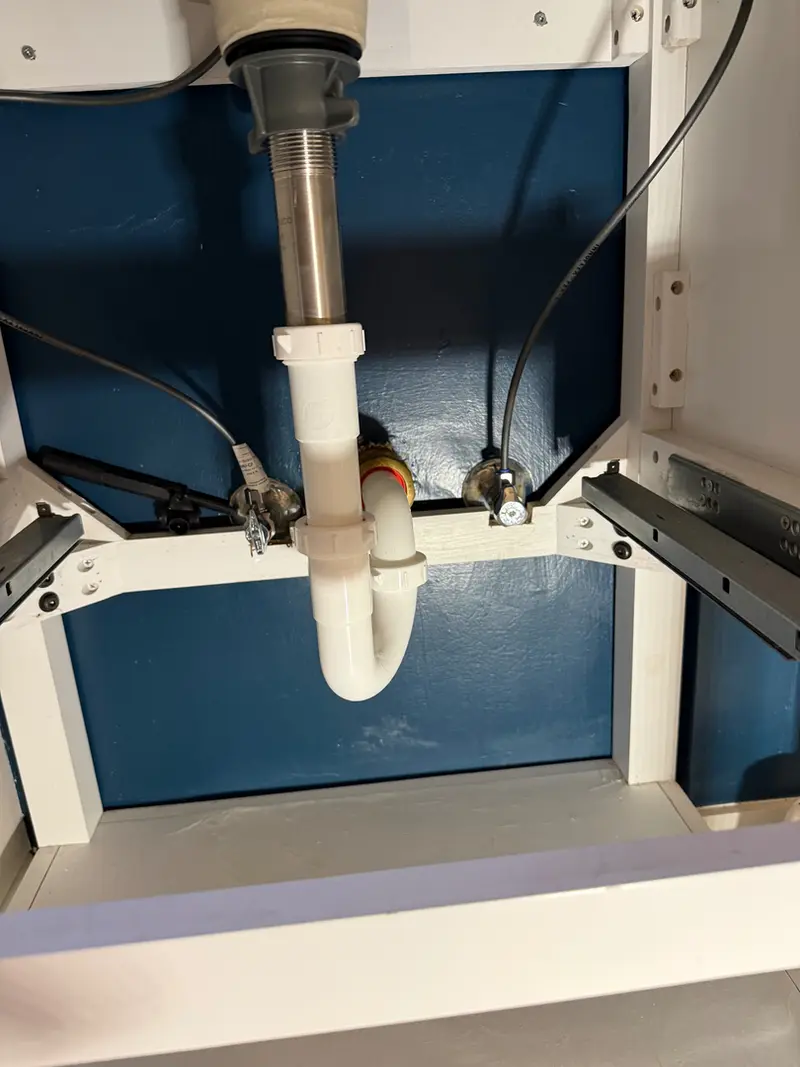 Under-sink P-trap and drain assembly repair in Boring, Oregon, drain cleaning and plumbing repair by Bigfoot Plumbing licensed plumber