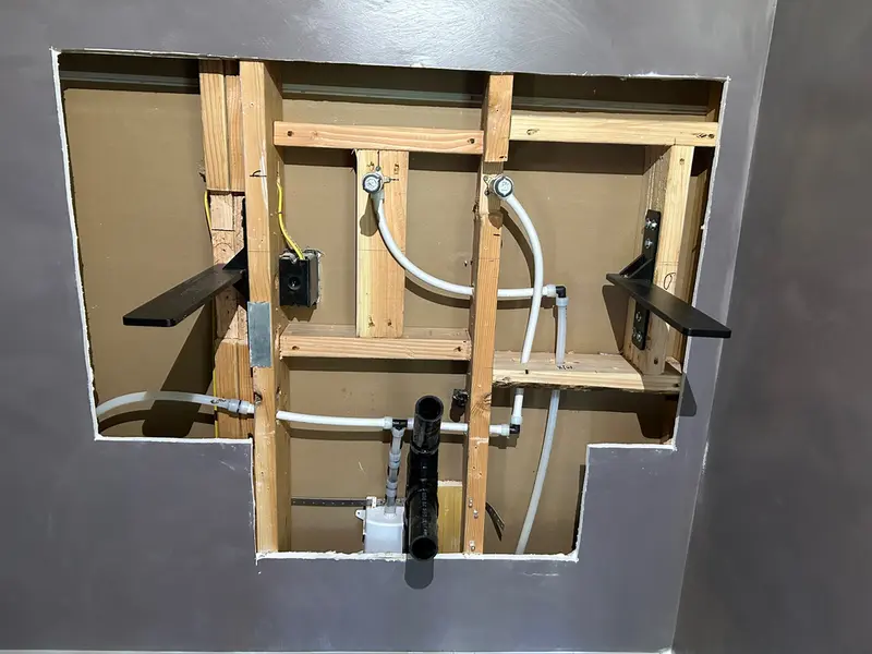 Wall-mounted vanity PEX rough-in plumbing for bathroom remodel in Sandy, Oregon, repipe and fixture rough-in by Bigfoot Plumbing